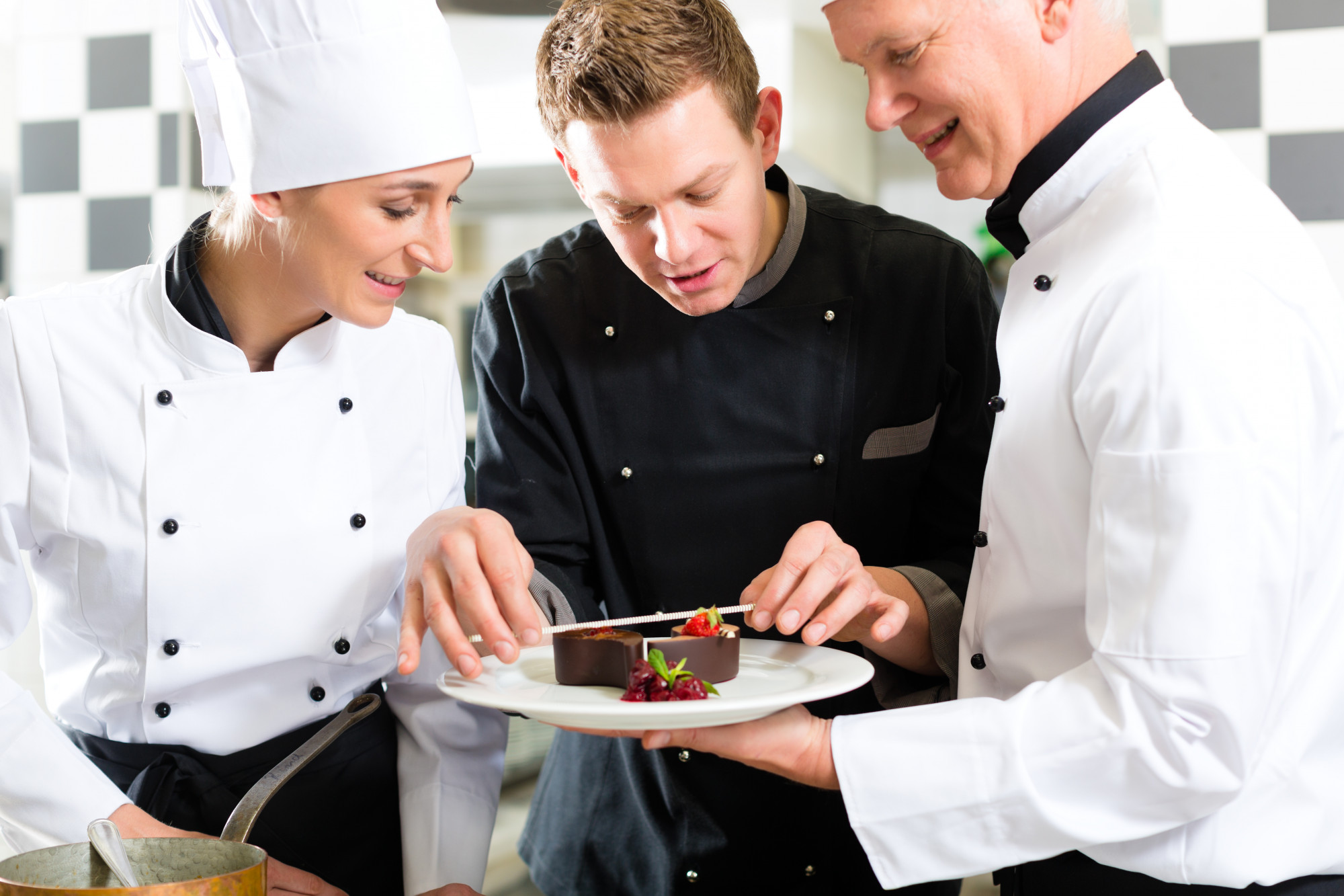 Instructor assisting student with plating